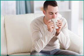 A man drinks mint tea hoping to cure erectile dysfunction. 